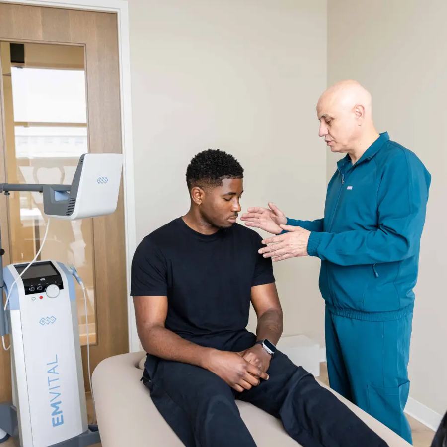 Dr. Sabah Jarullah with a patient in the medical treatment room