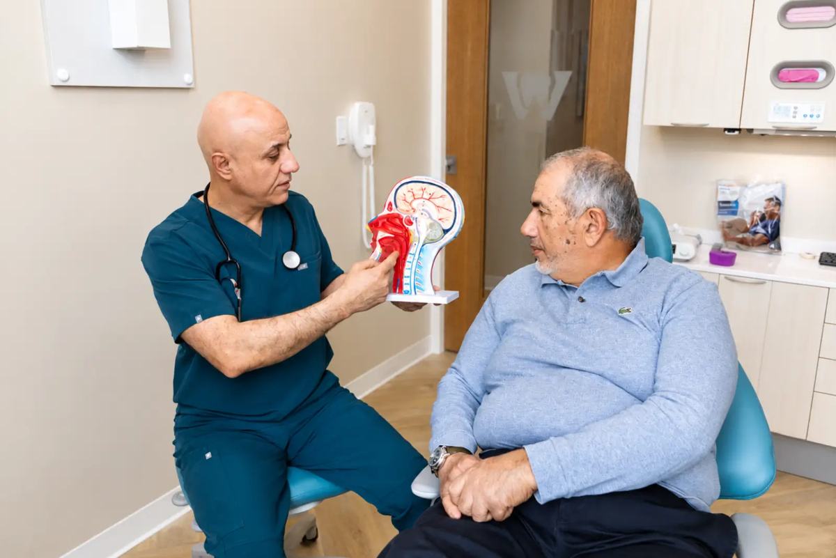 Dr. Sabah Jarullah explaining the airway on an anatomical model at Westside, Calgary SW