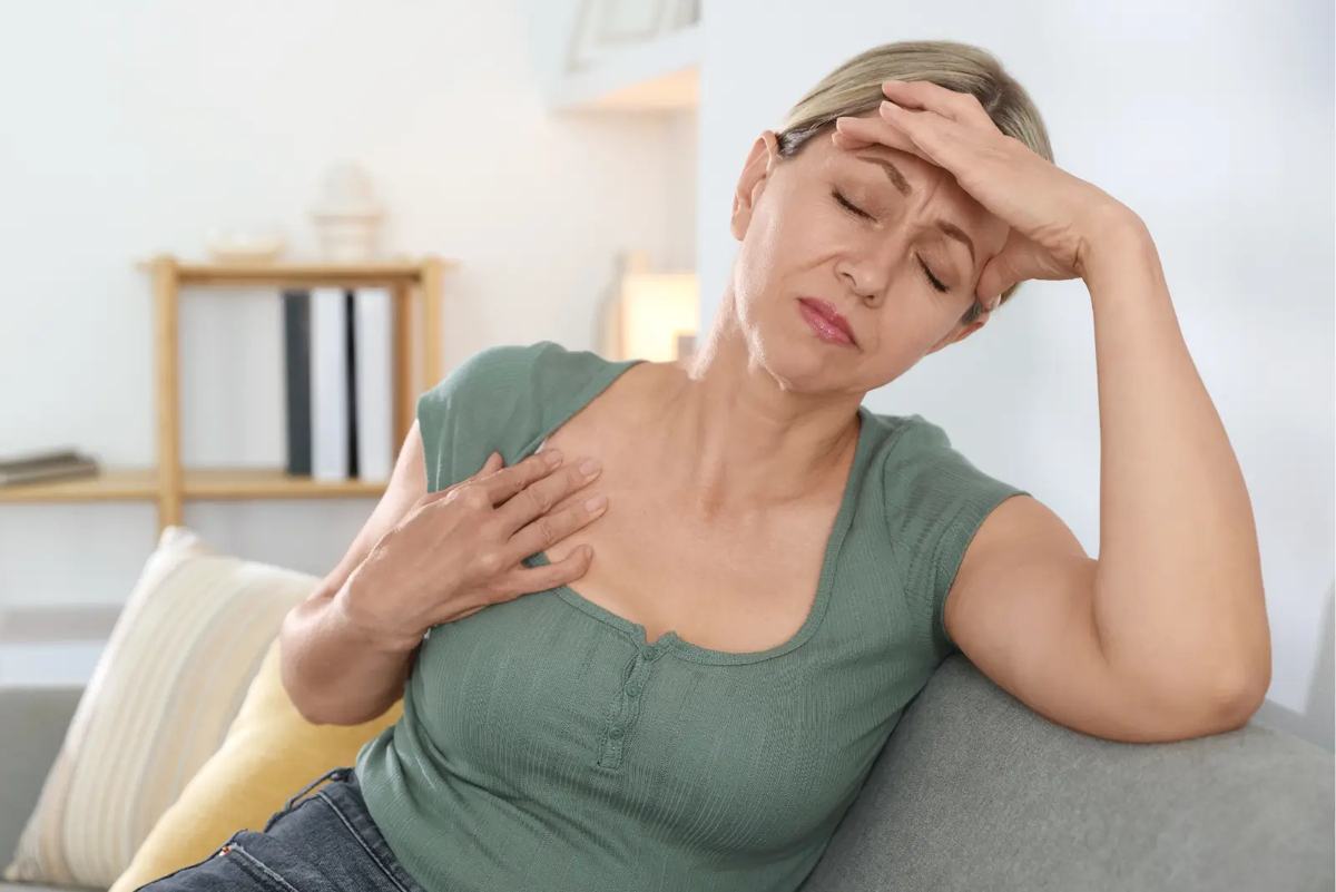 A woman managing menopause symptoms
