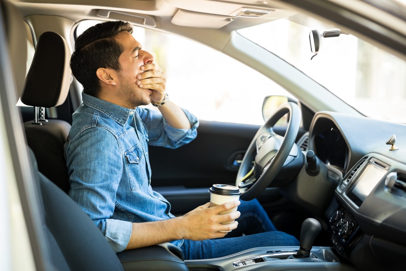 Tired driver yawning at the wheel – untreated sleep apnea raises crash risk