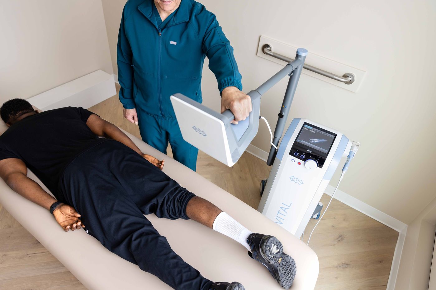 EMVITAL® laser therapy applied to the back at Westside, Calgary SW