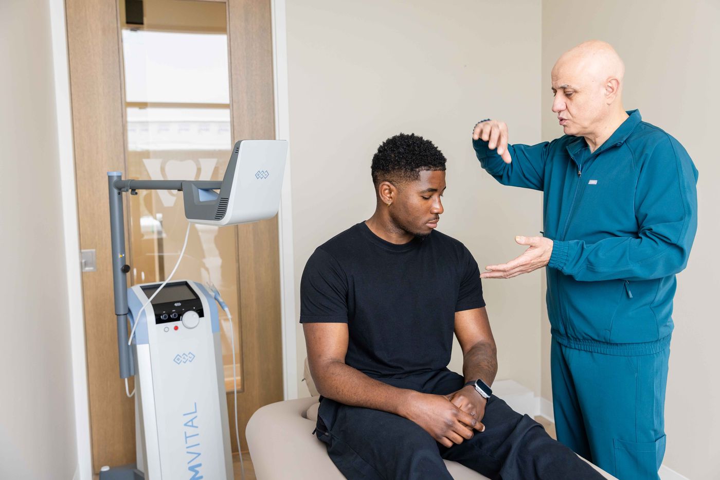 Dr. Sabah Jarullah assessing a patient before EMVITAL® therapy