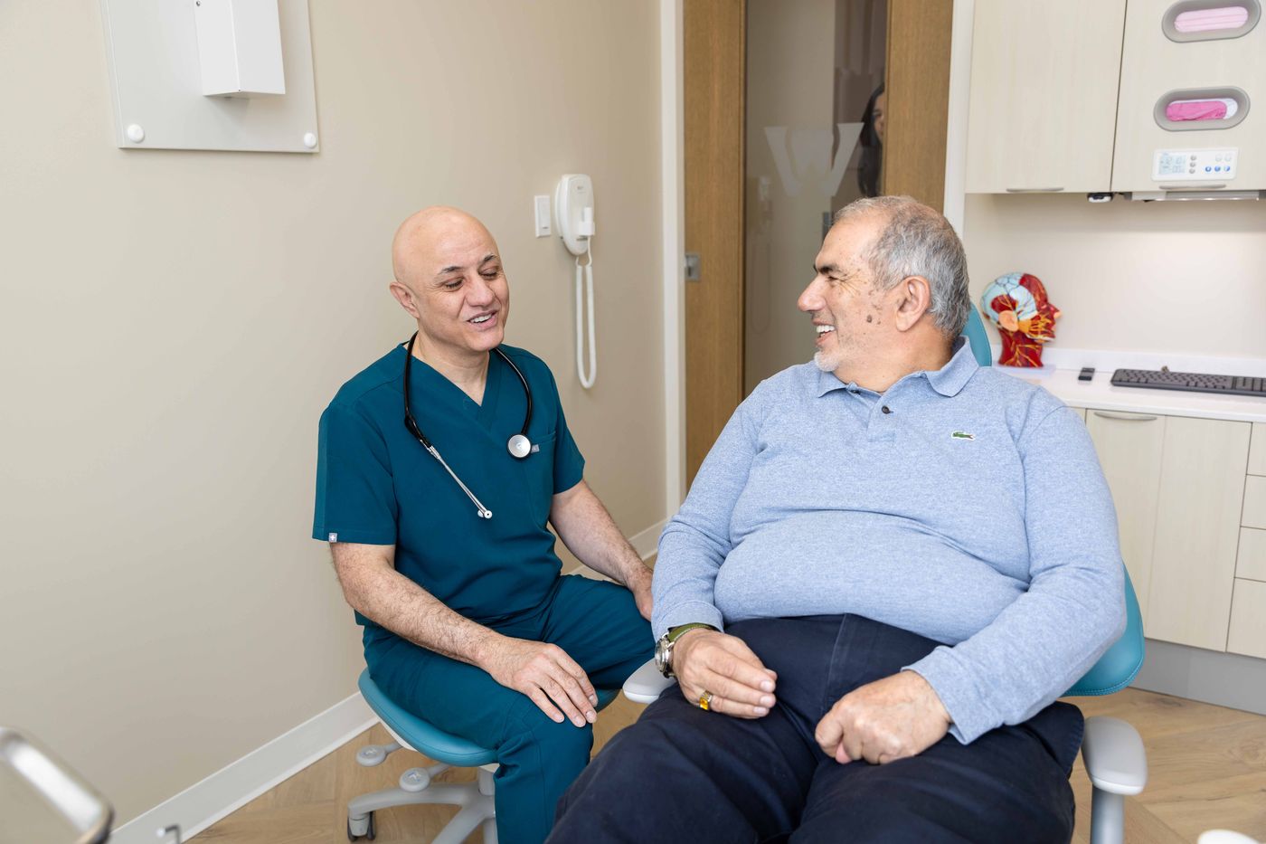 Dr. Sabah Jarullah, family physician, in consultation at Westside, Calgary SW