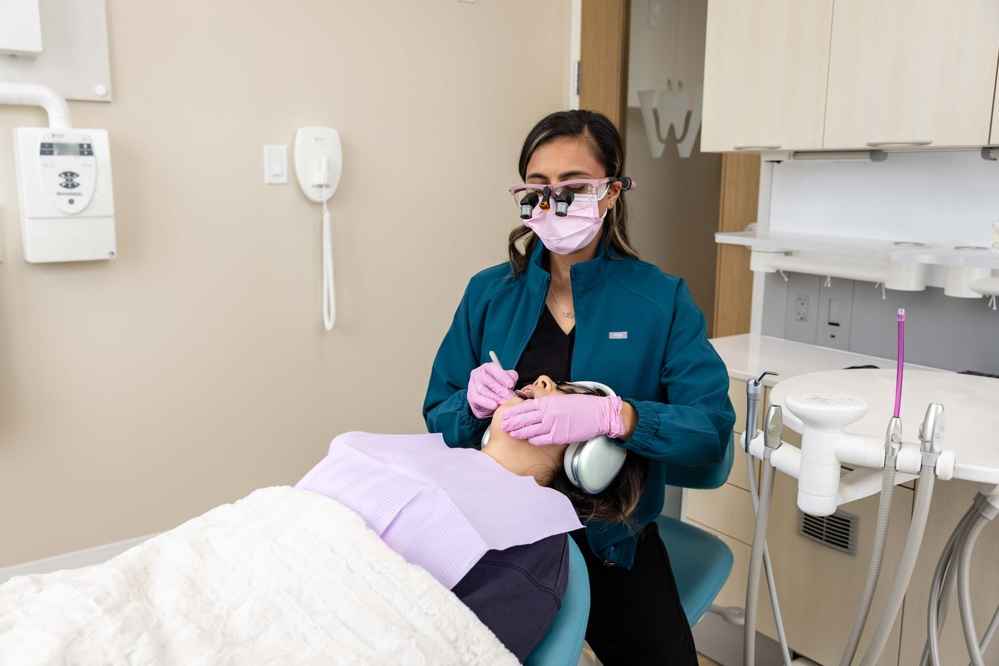 Alysha, registered dental hygienist, during a cleaning at Westside, Calgary SW