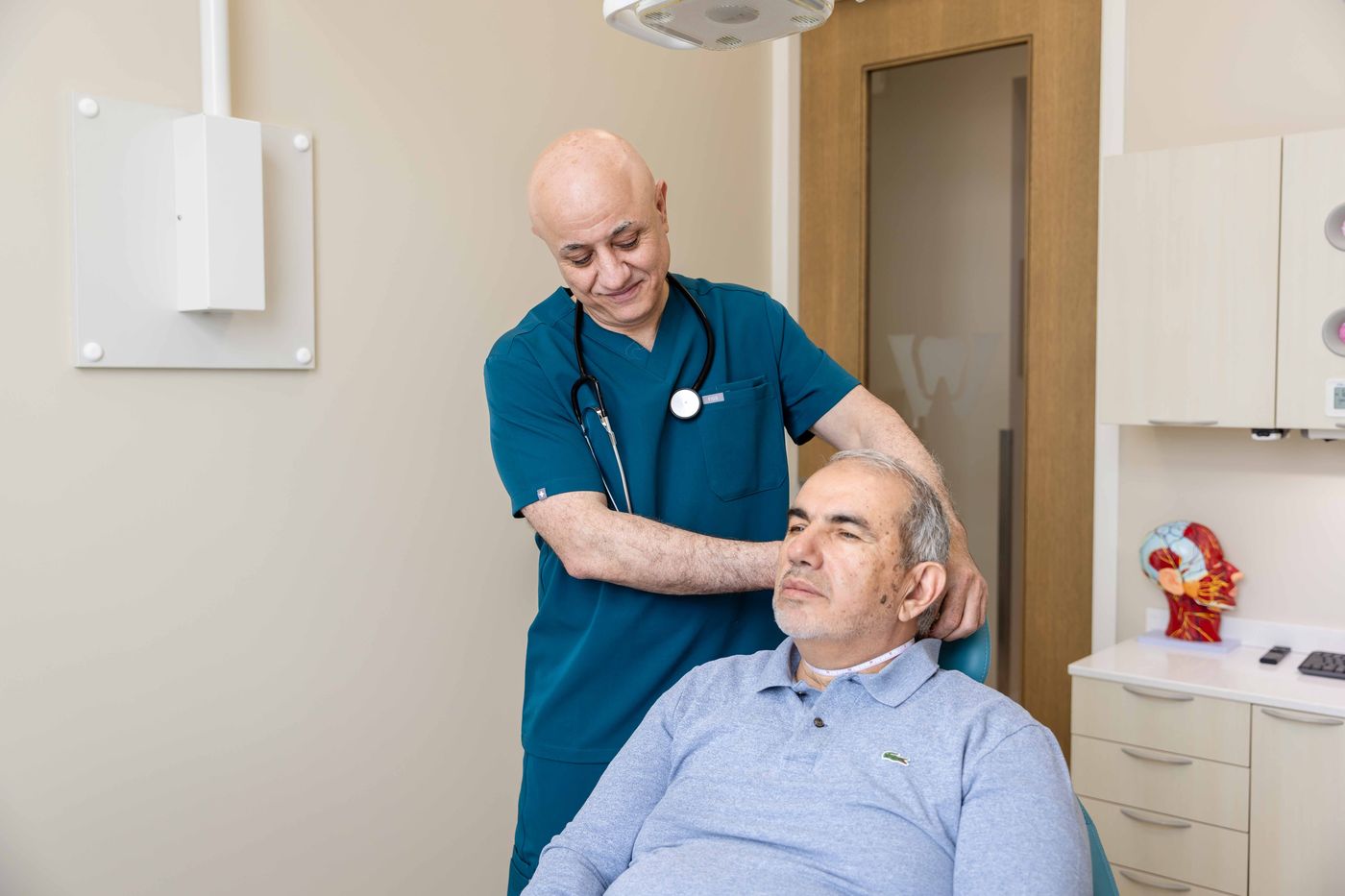 Dr. Sabah Jarullah examining a patient during a sleep assessment at Westside, Calgary SW