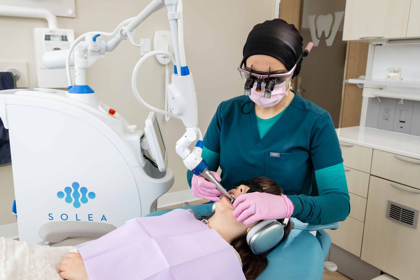 Dr. Zubaida Hussain treating a patient with the Solea® laser at Westside, Calgary SW