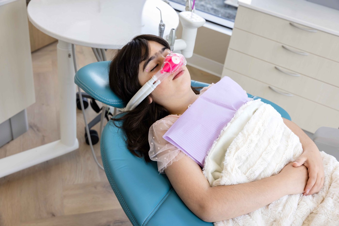 A young patient relaxed with nitrous oxide sedation at Westside